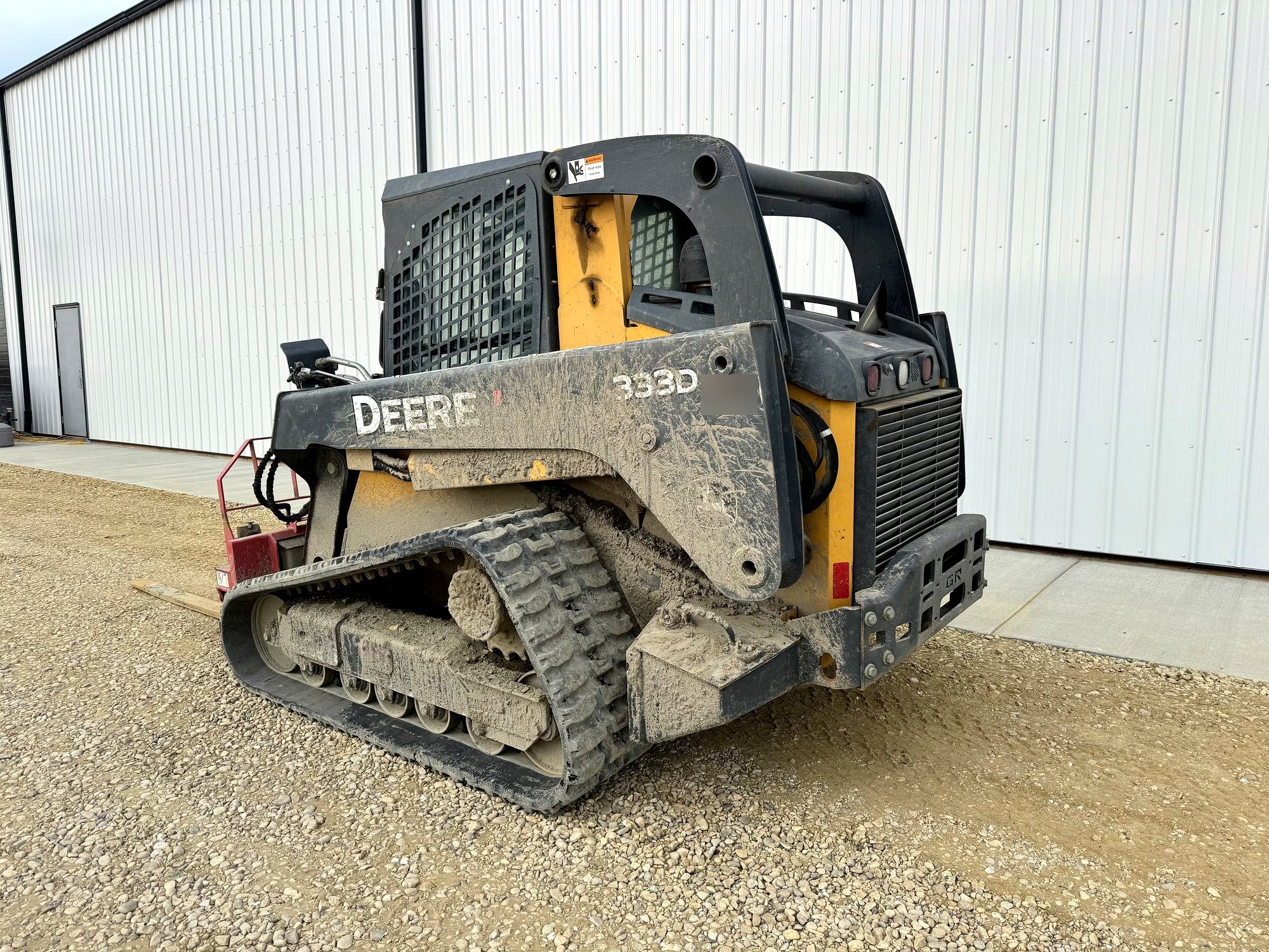 John Deere 333 compact track loader in the equipment yard