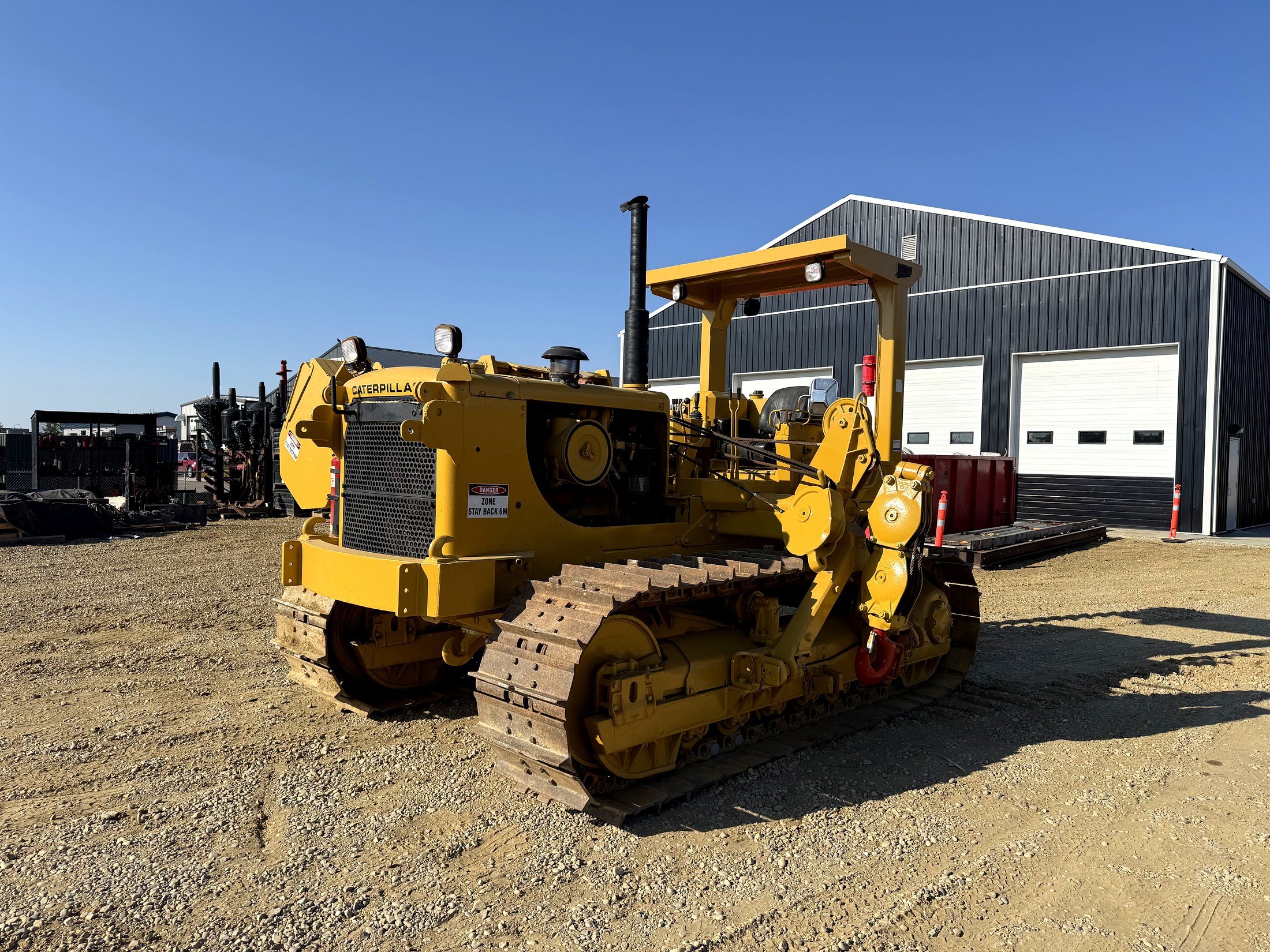 Caterpillar pipelayer crawler, unit 571, hook rigging fitted, in the equipment yard