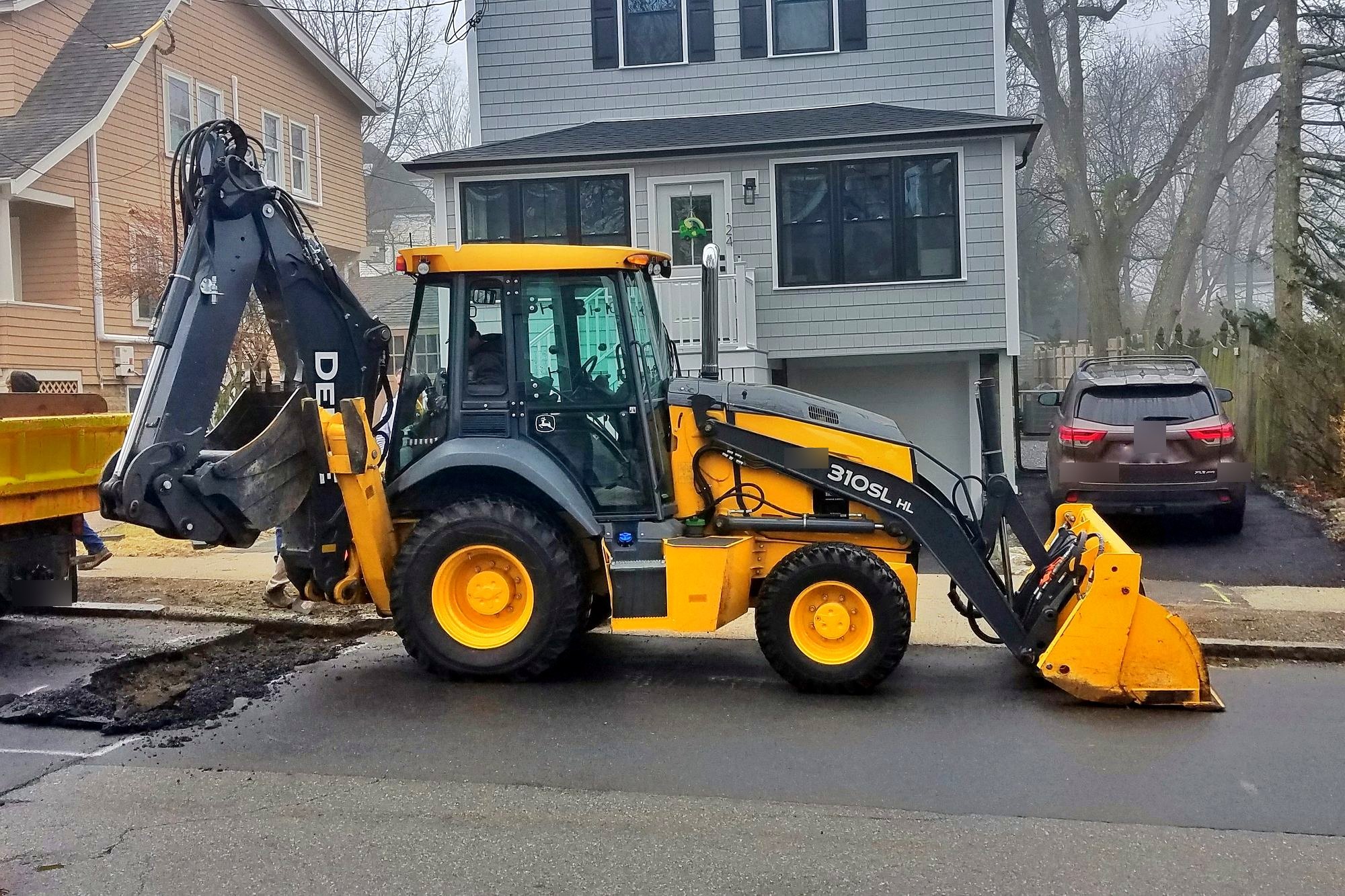 John Deere 310SL HL backhoe loader, host machine for SE-X007
